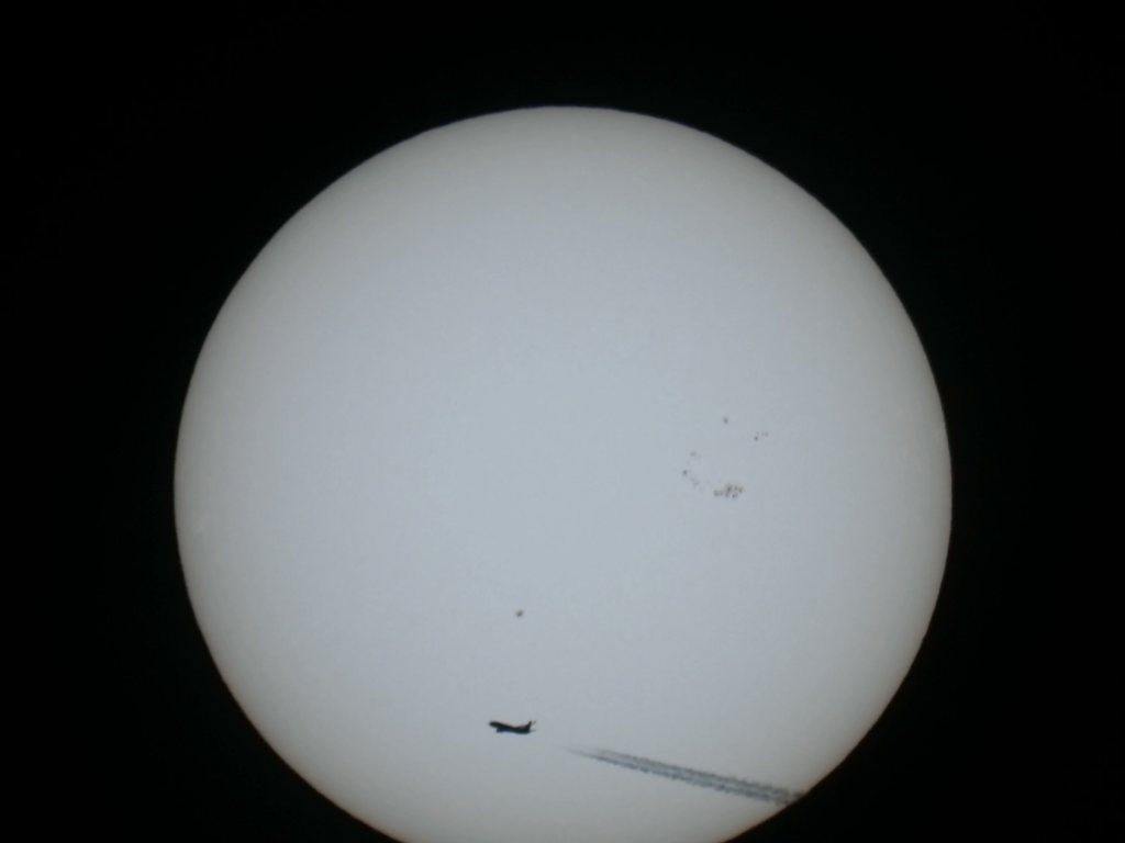Video: a plane crossing the sun