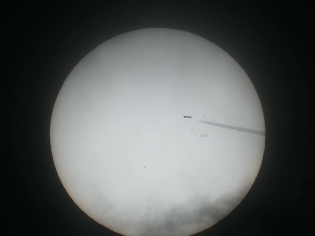 Video: a plane crossing the sun