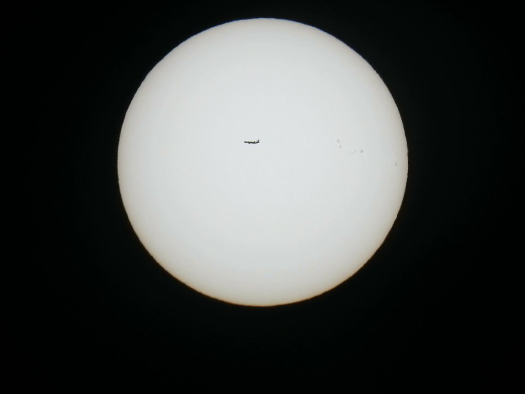 Video: a plane crossing the sun